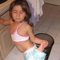 Leilani posing with her eyes almost closed