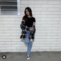 Leilani holding up the wall and posing